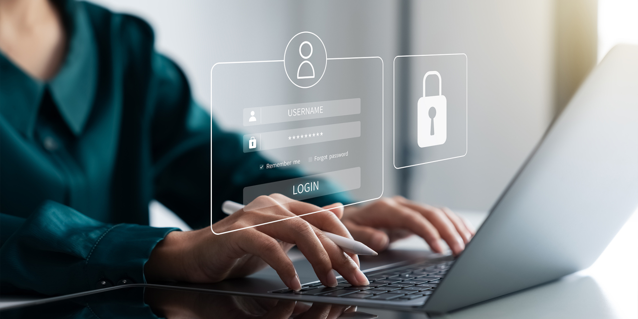 Woman working on computer with secure login overlay.