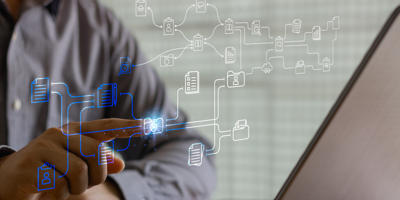 Man touching interactive screen with icon overlays.