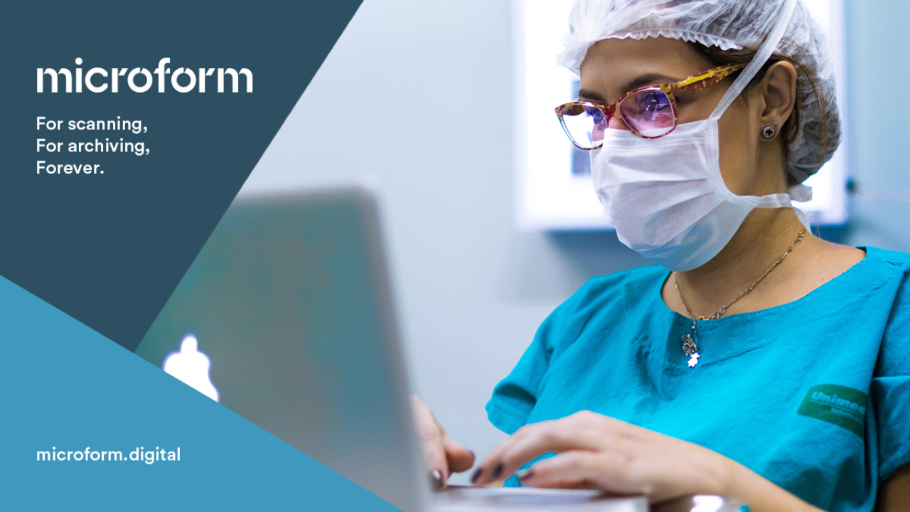 Microform Branding - Dentist reading information from a computer.